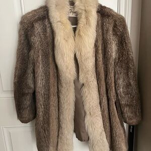 Fur Coat. Front collar is fur and the rest I do not remember. I am 5 ft tall.